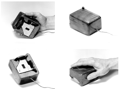 Imagem mostra detalhes do primeiro mouse de computador, um protótipo feito de madeira.
