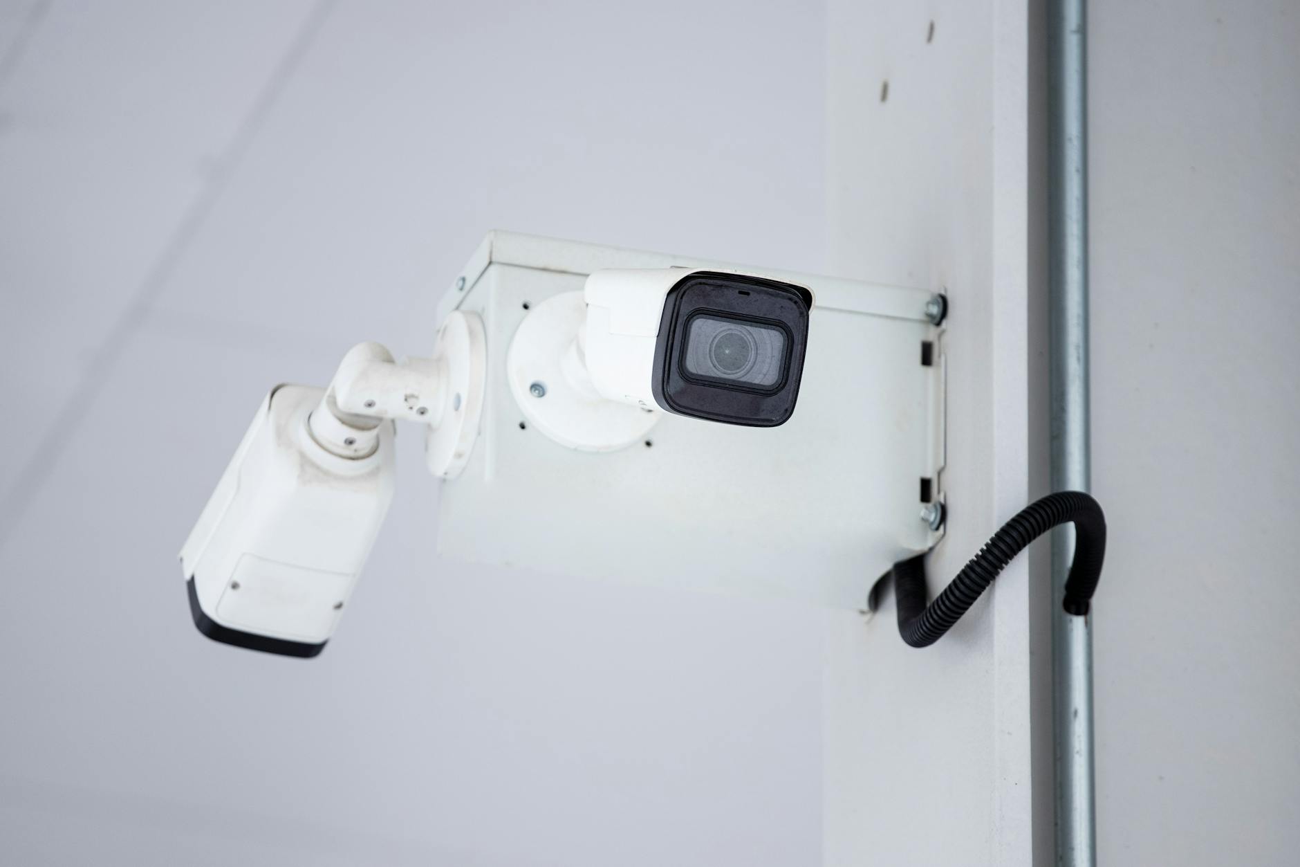 mounted surveillance camera on the wall